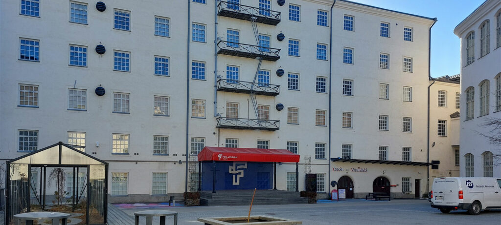 Large white old city building.